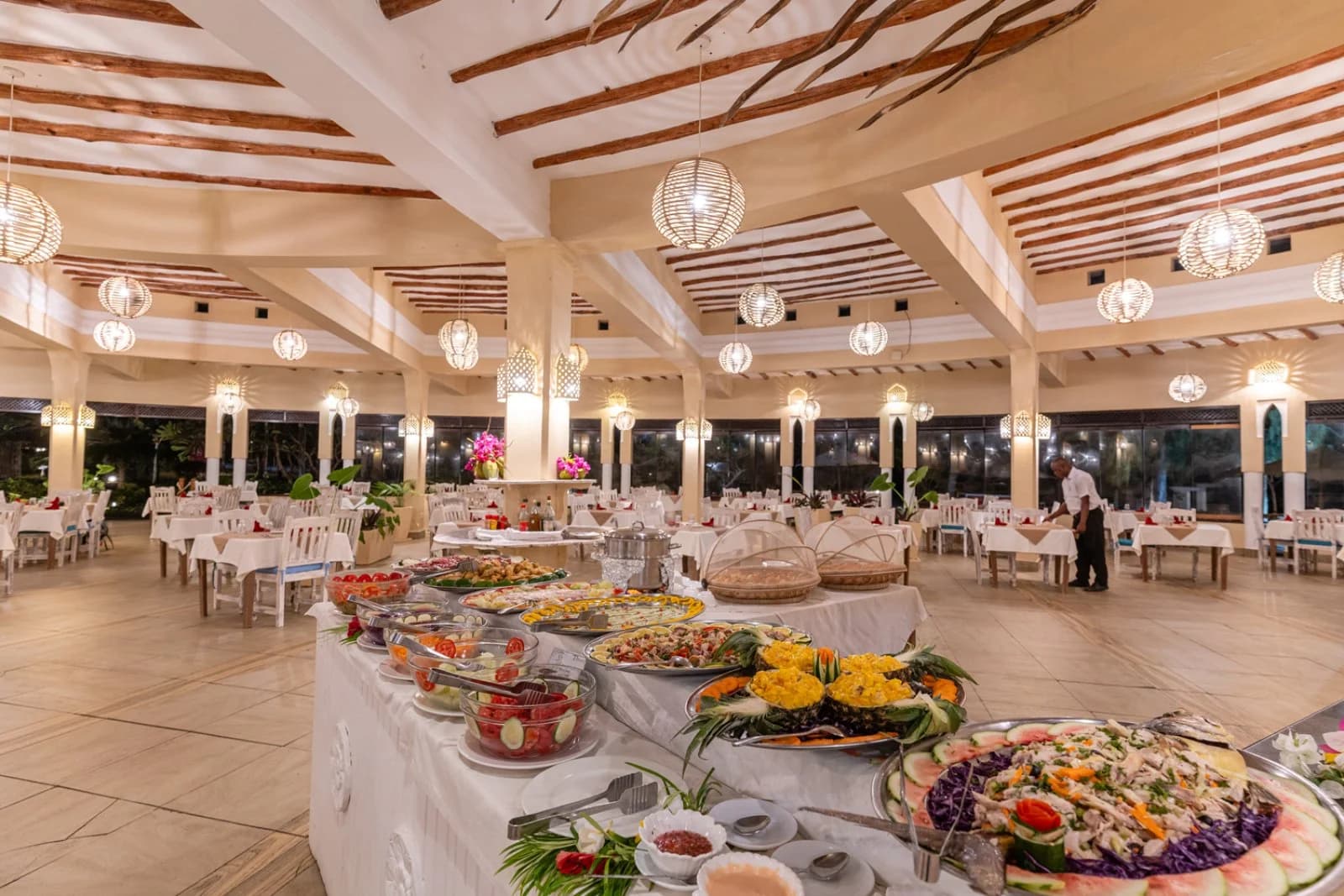 A buffet laid out in a large dining hall at a conference venue on the Kenyan coast